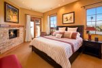 Enjoy the king size bed, flat screen tv and fireplace in the master bedroom